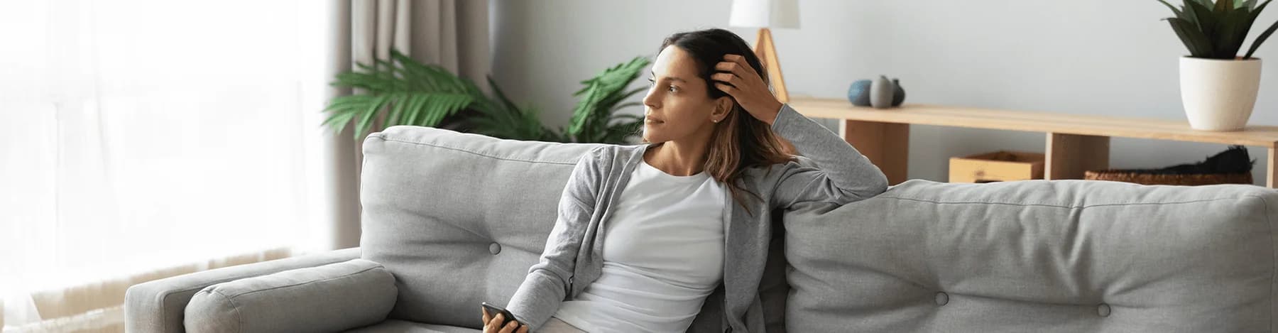 Woman relaxing in a comfortable home