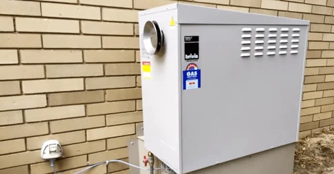 Brivis gas ducted heating unit beside a brick home