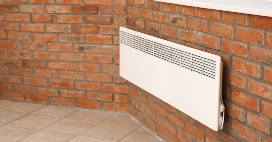Modern Heating Convector On Brick Wall Indoors