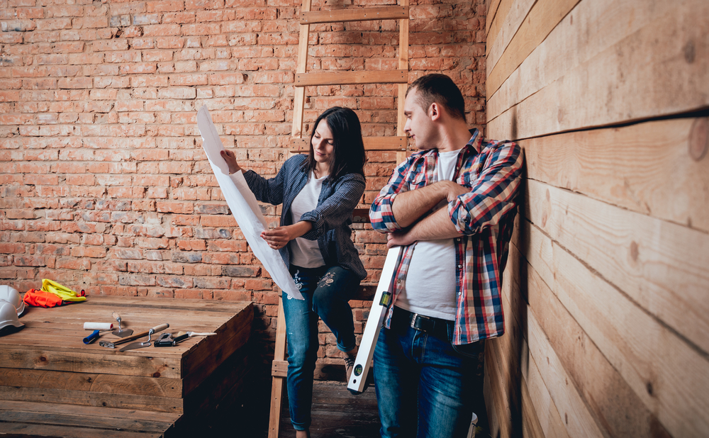 Happy couple planning renovations in their home