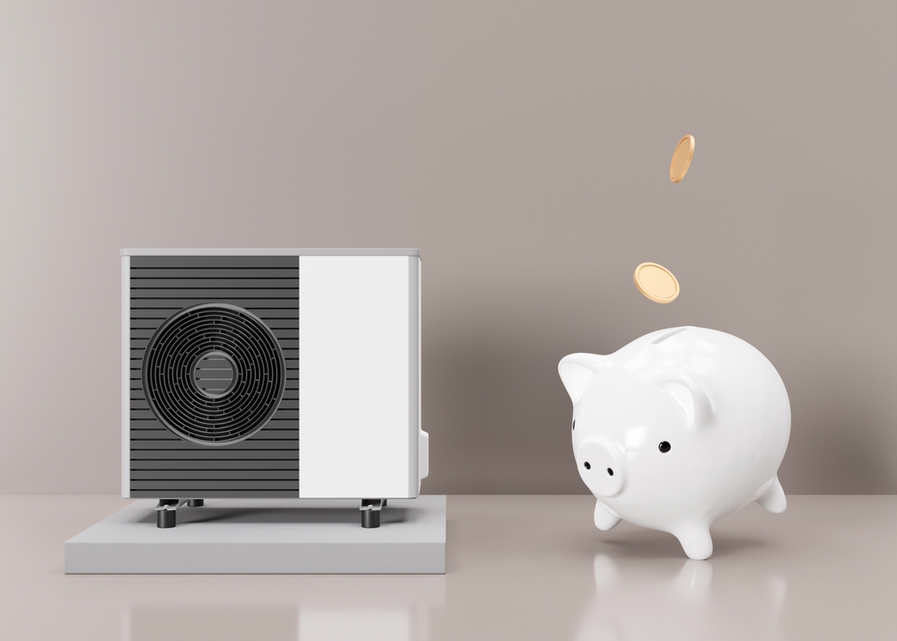 Heat pump air conditioner with a white piggy bank next to it. Coins are falling into the piggy bank.