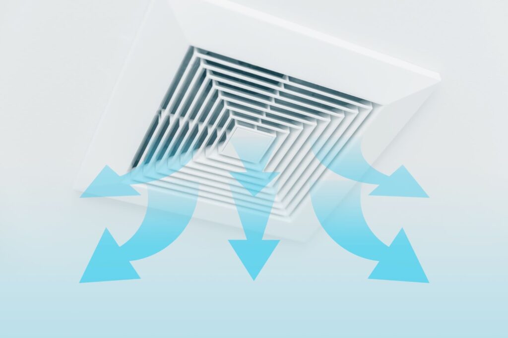 Duct for a ducted air conditioning system, with blue arrows radiating outward representing cold air.